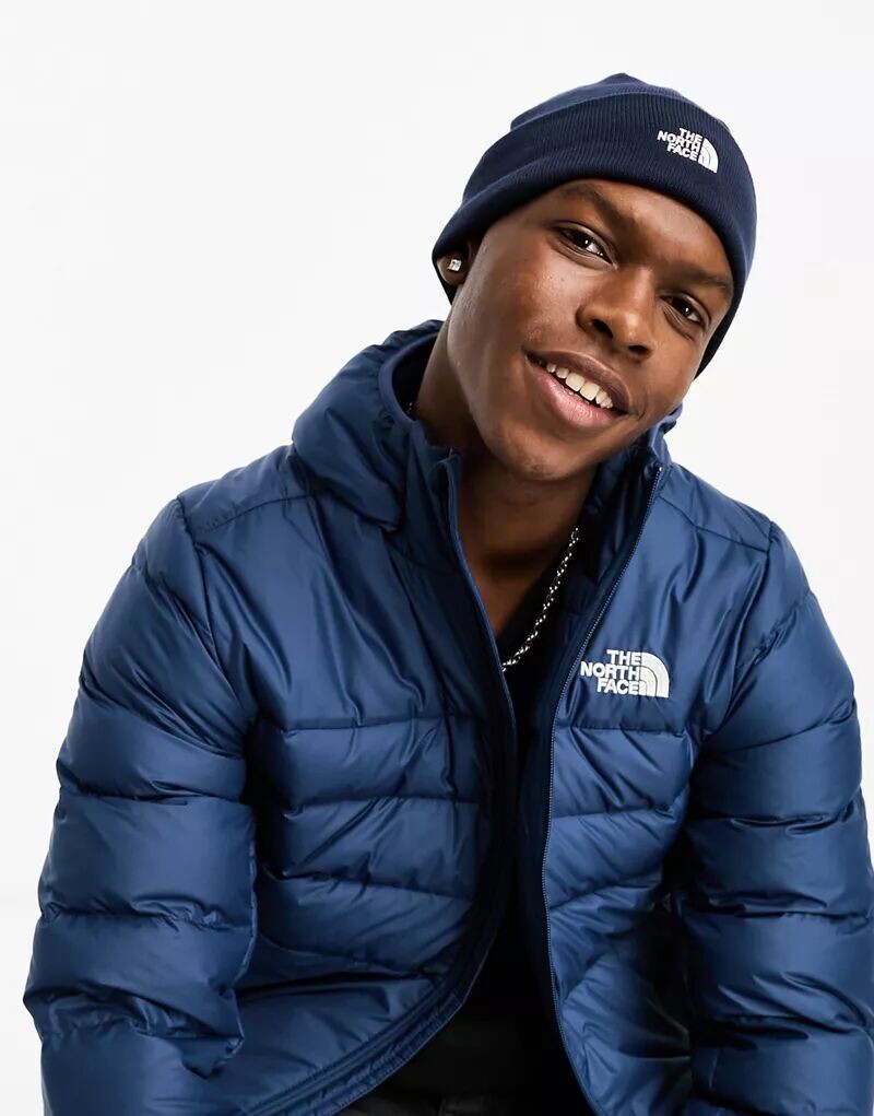 

Темно-синяя вязаная шапка The North Face Norm Shallow
