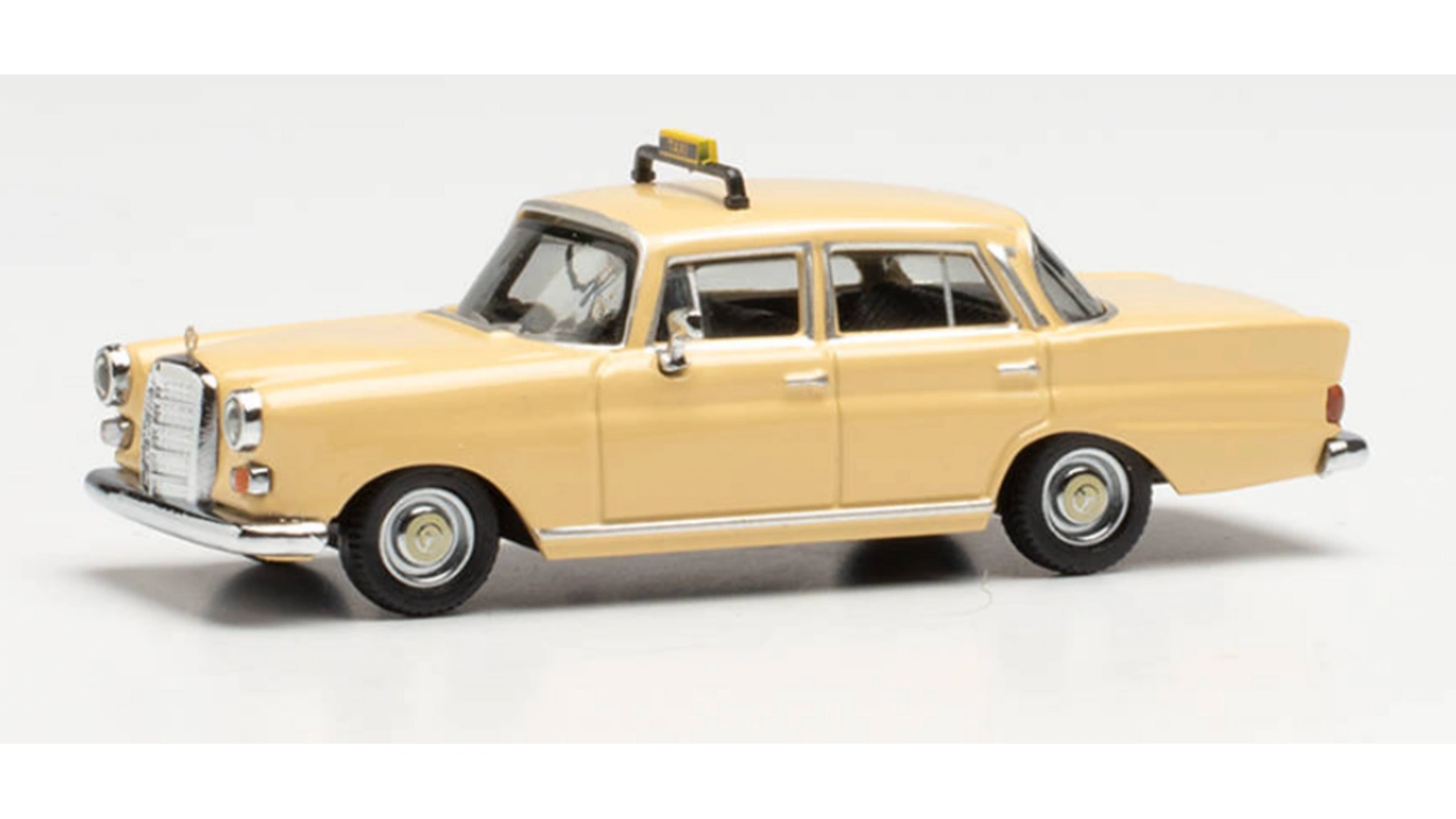 

1:87 mercedes-benz 200 tailfin taxi, цвет слоновой кости Herpa