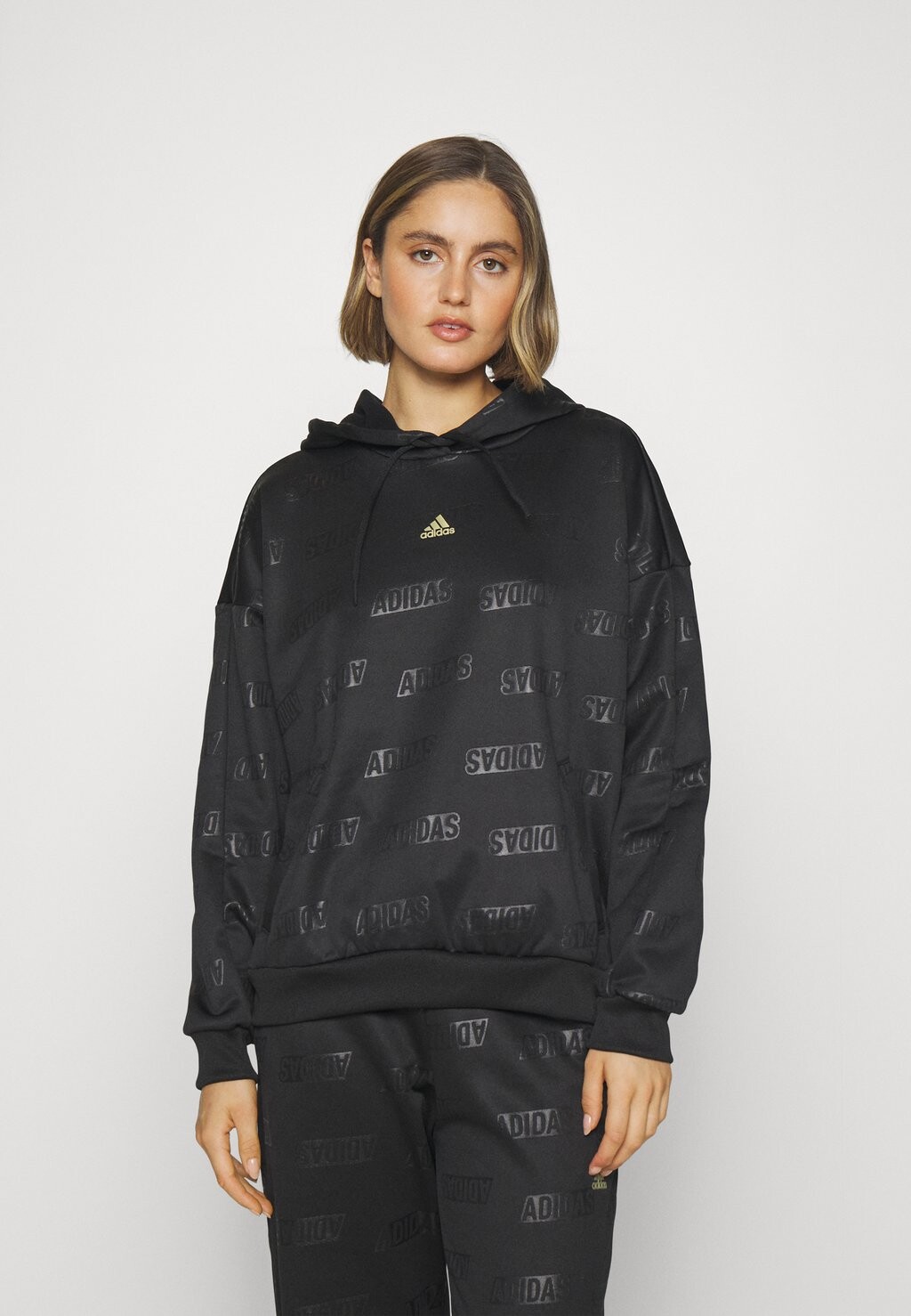 

Толстовка BLUV adidas Sportswear, черный/золотой металлик