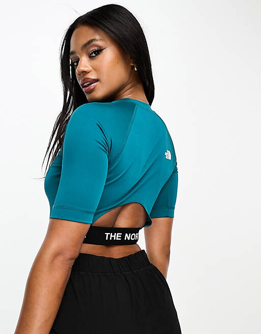 

Бирюзовый укороченный топ для тренировок The North Face Training