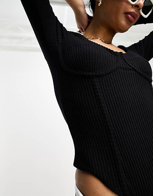 

Черное боди в рубчик со швами на груди и длинными рукавами ASOS DESIGN
