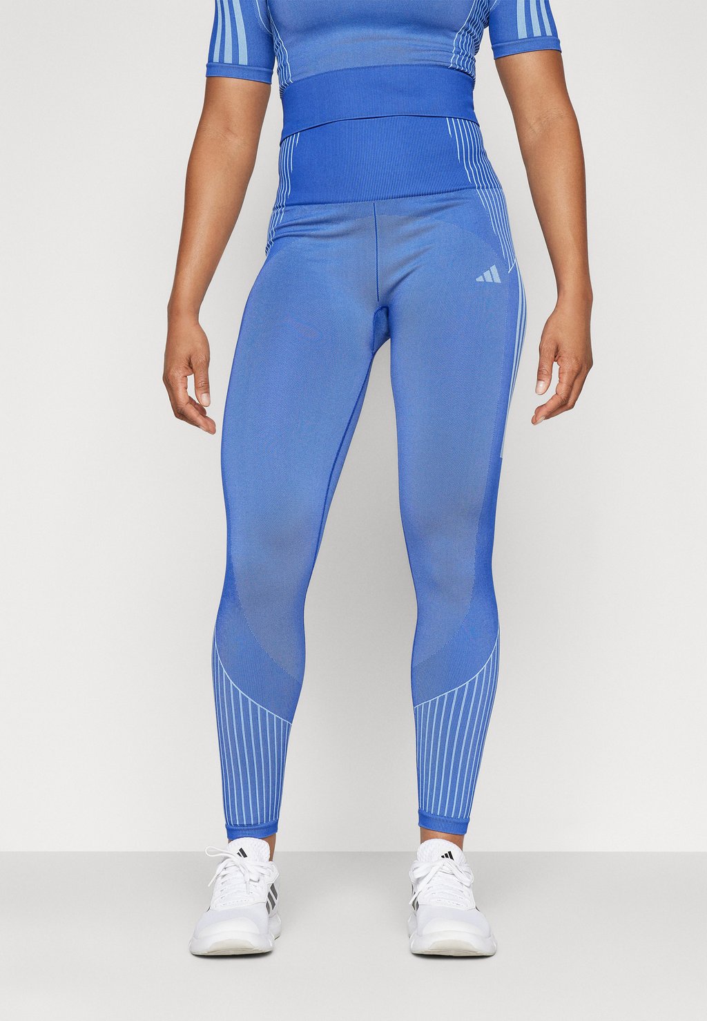 

Леггинсы SEAMLESS BRANDED 7/8 adidas Performance, цвет semi lucid blue