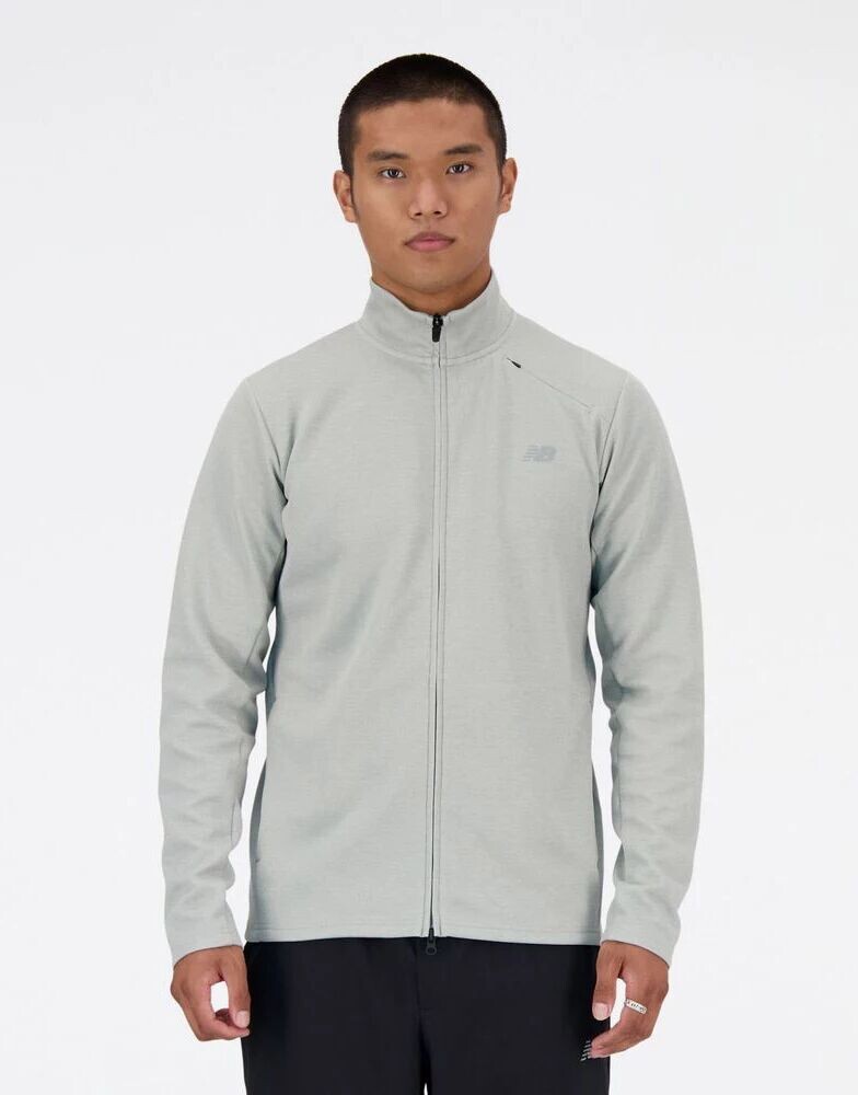 

Серая куртка на молнии из технического трикотажа New Balance
